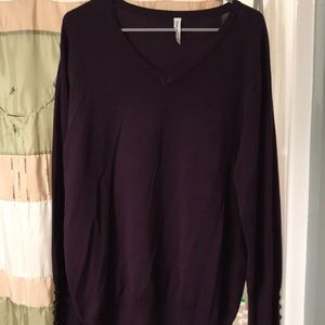 Wine color sweater.